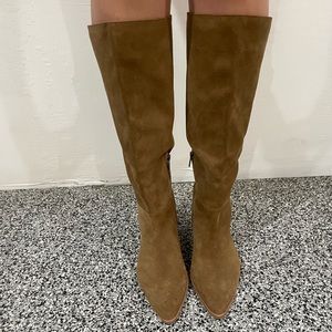 Vince Camuto sleek, Chic boot is a wardrobe must-have for fall. Suede design.